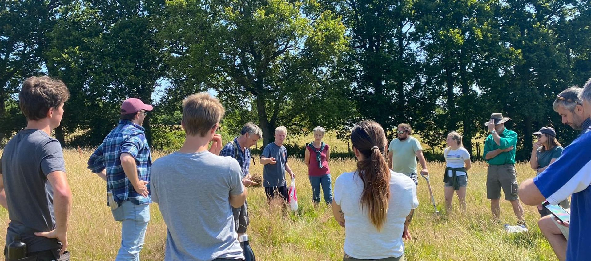 Group watching soil testing